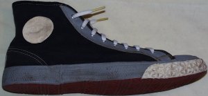 1948 Converse high-top gym shoes: black uppers, gray fabric trim, white rubber trim, red sole)