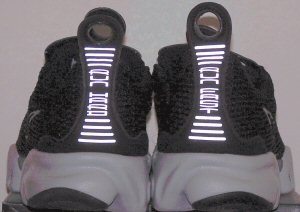 Nike Air Kukini running shoe back view (black/gray/reflective)... 'Run Hard, Run Fast'