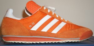 The adidas SL-72 in orange with white stripes and trim