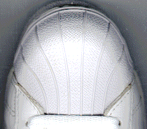 Closeup view of the adidas "Shell Toe" shoe toe Closeup view of the adidas "Shell Toe" shoe toe