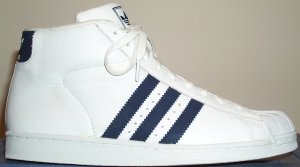 The adidas Promodel high-top basketball shoe: white with dark blue stripes The adidas Promodel high-top basketball shoe: white with dark blue stripes
