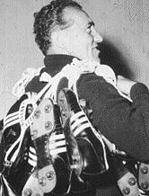 Adi Dassler, founder of adidas, with a bunch of adidas cleats slung over his shoulder Adi Dassler, founder of adidas, with a bunch of adidas cleats slung over his shoulder