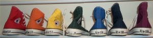 A rainbow of high-top Chucks: red, orange, yellow, green, blue, indigo, violet