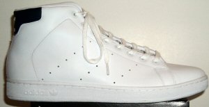 The adidas Stan Smith high-top tennis shoe, with dark blue trim