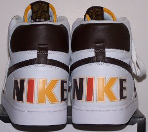 Heel view of Nike Terminator basketball shoes in white with brown/yellow/orange trim